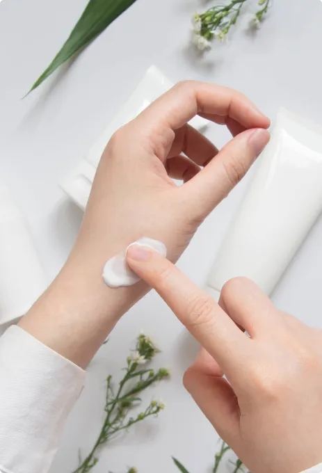 Woman hand with face cream on the finger